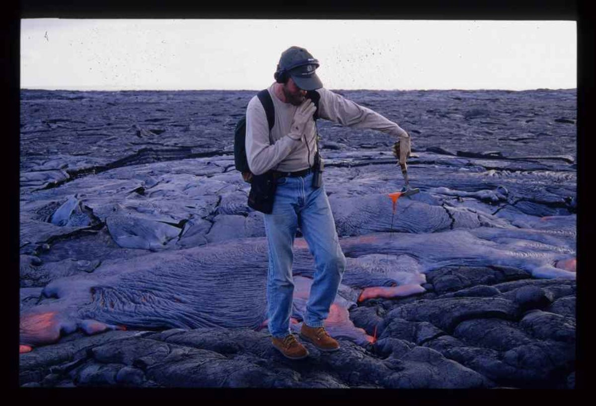 Steve Mattox, geology, taking lava sample in Hawaii