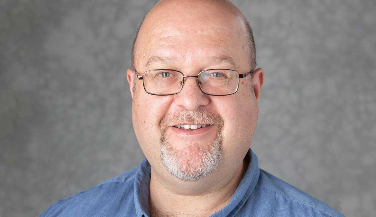 Headshot of Editor, Gerry Simons