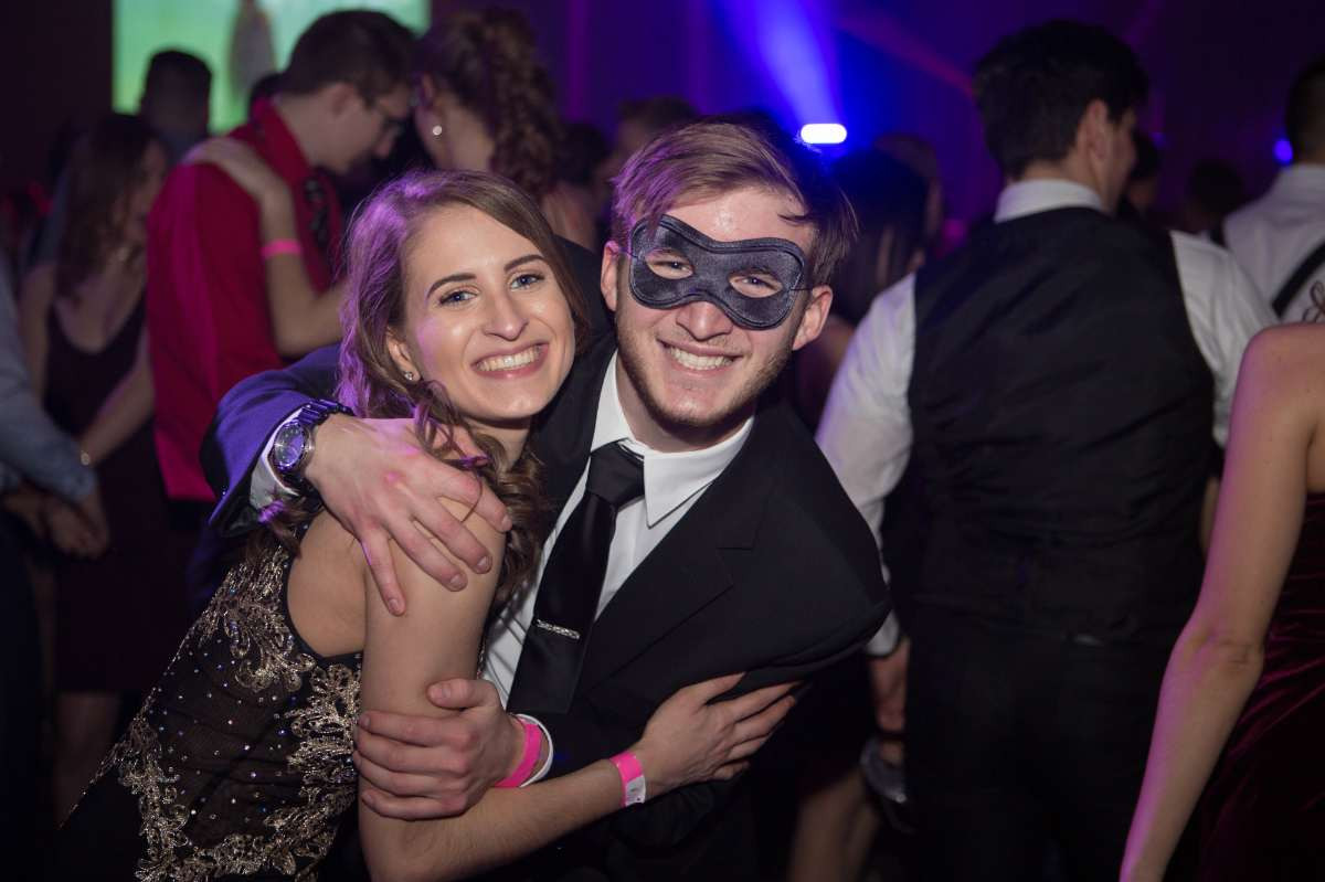 Two students hugging at the presidents ball