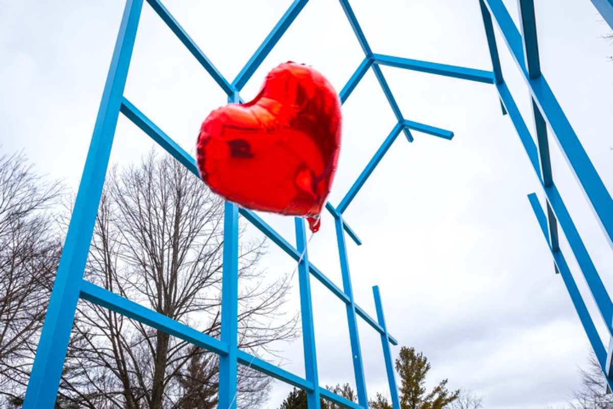 a red heart balloon in front of the transformation link
