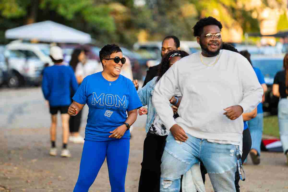 Mother and student walking to football game