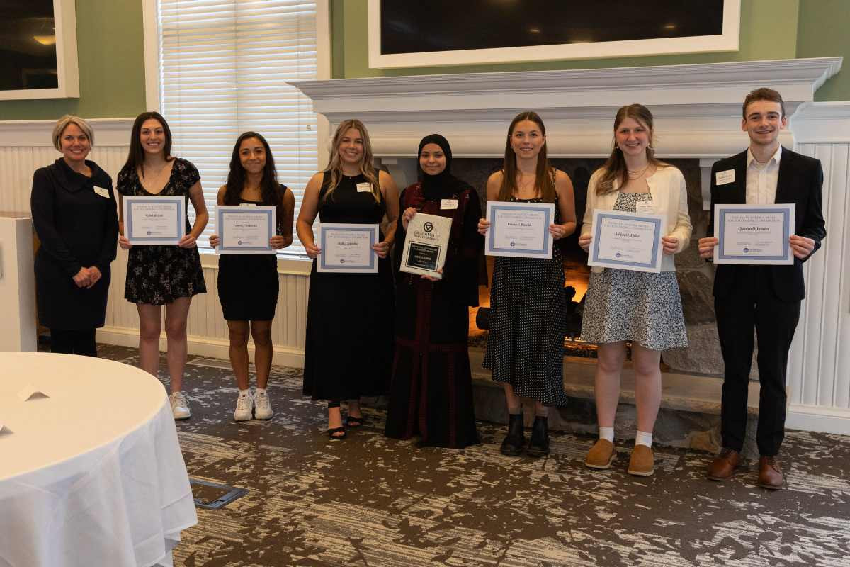 Eight Lakers posing with their awards from the Dean Of Students ceremoney as they were recognized at the annual Student Leadership Awards dinner