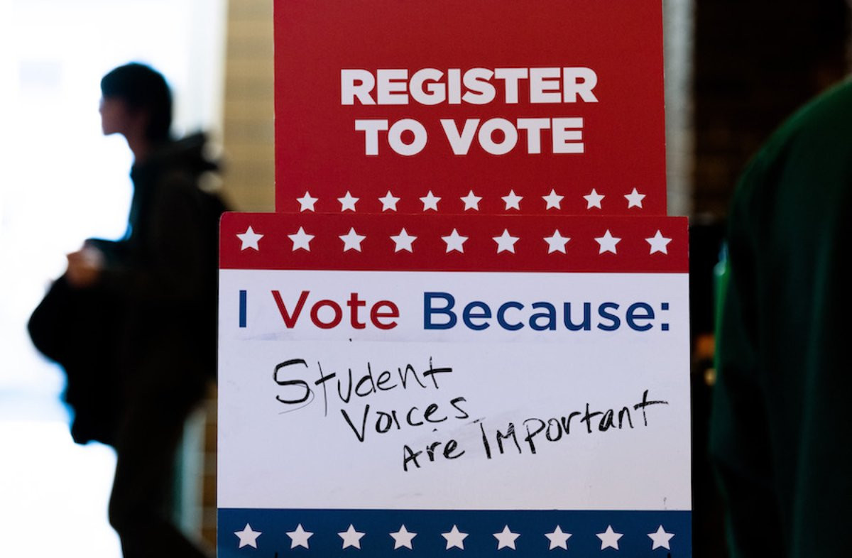 A sign that reads: Register to Vote. I Vote Because Student Voices Are Important