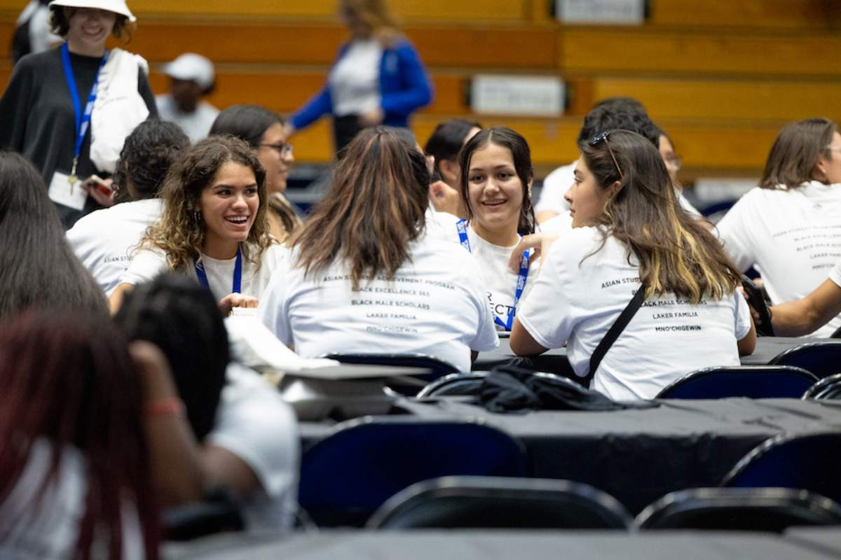 students sitting around at a table during conversations of color series