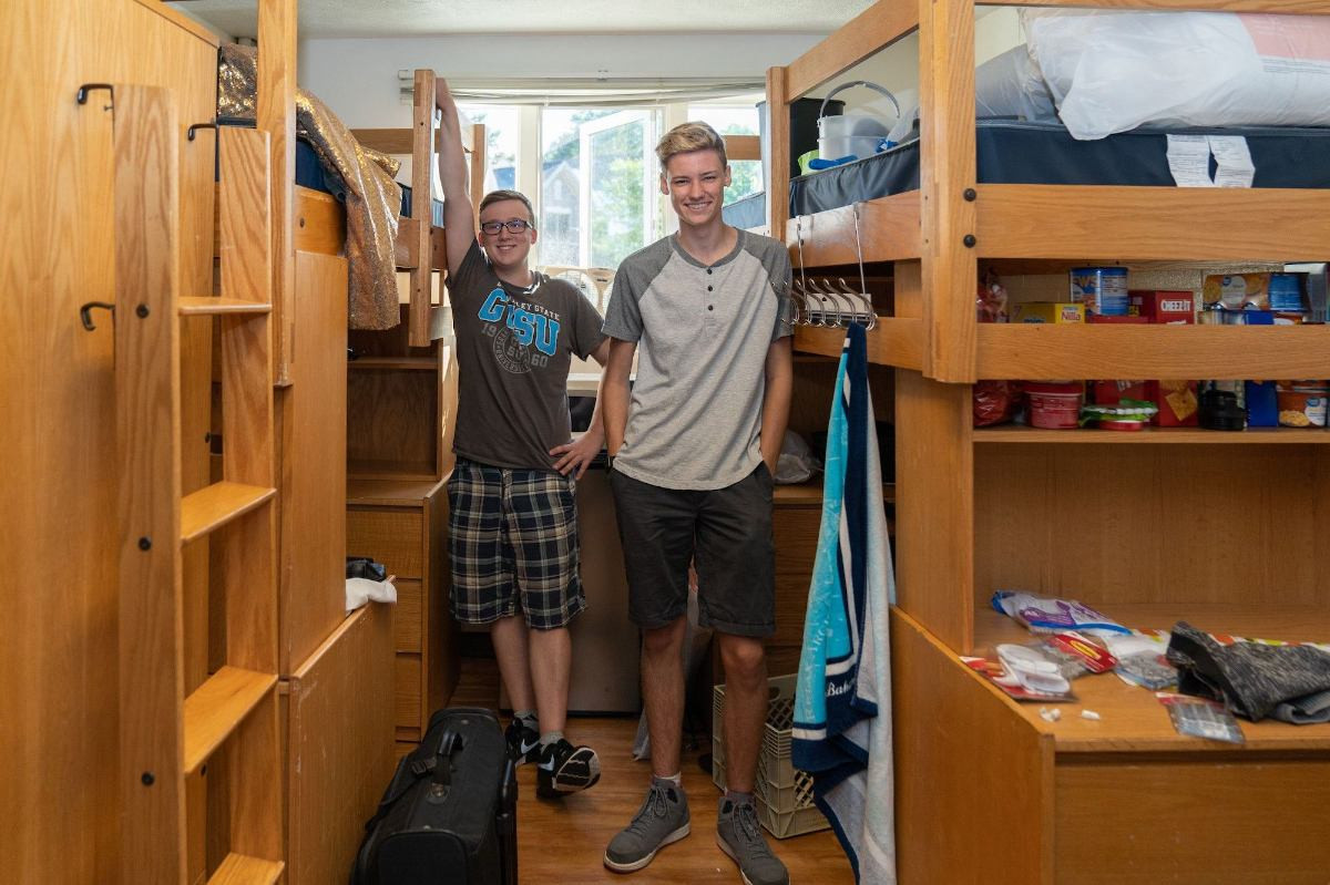 Student moving into their dorm room