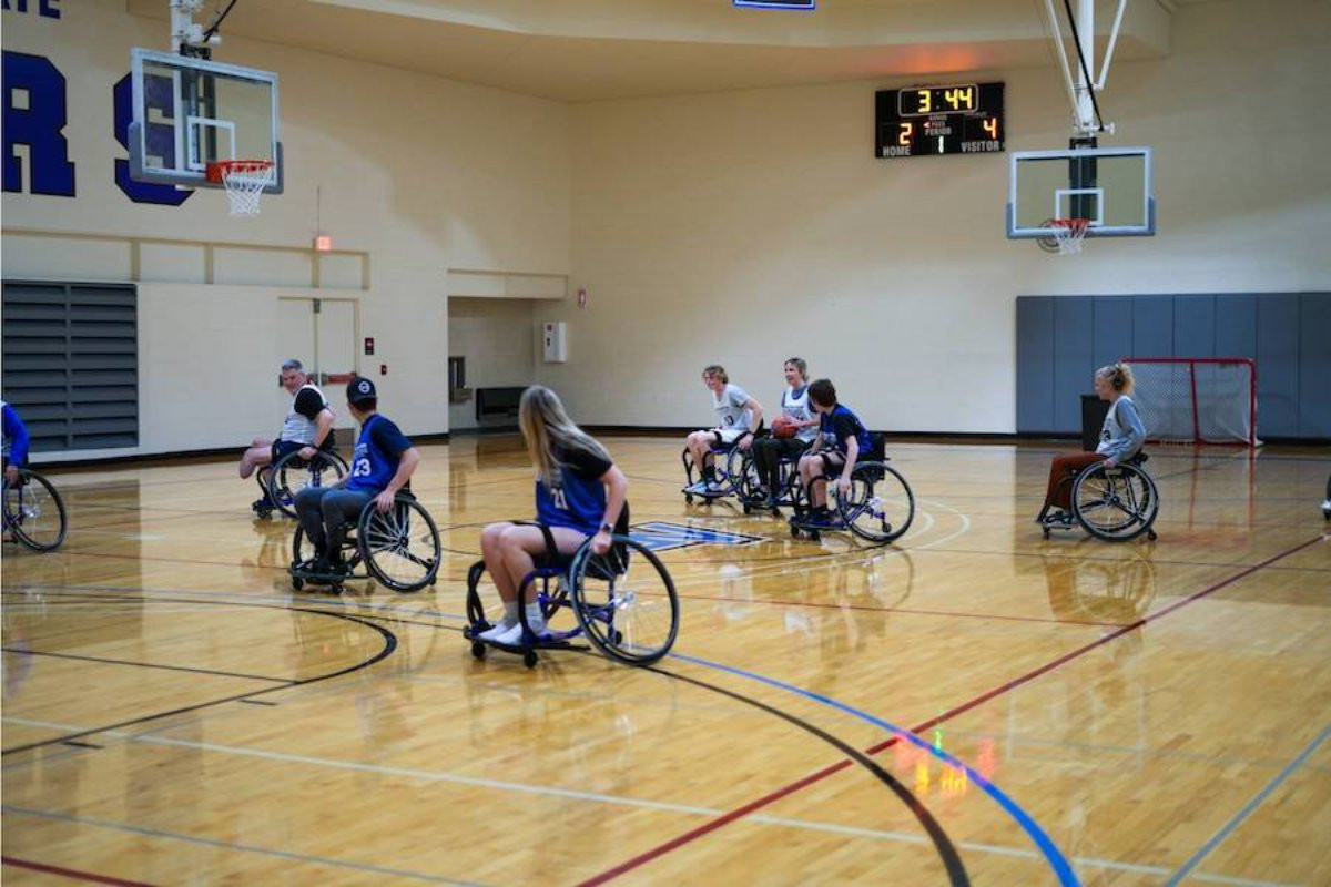 Group of people playing wheelchair football at the rec center