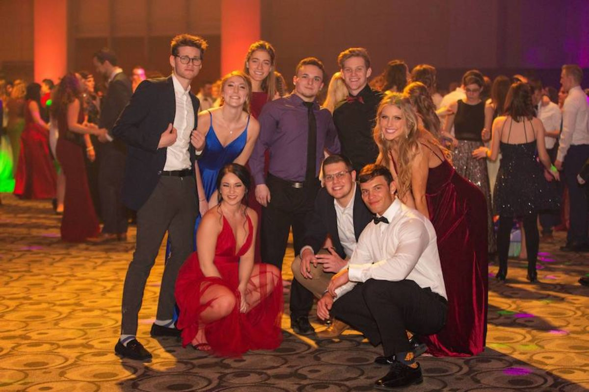 A group of people at the President's Ball posing for a picture