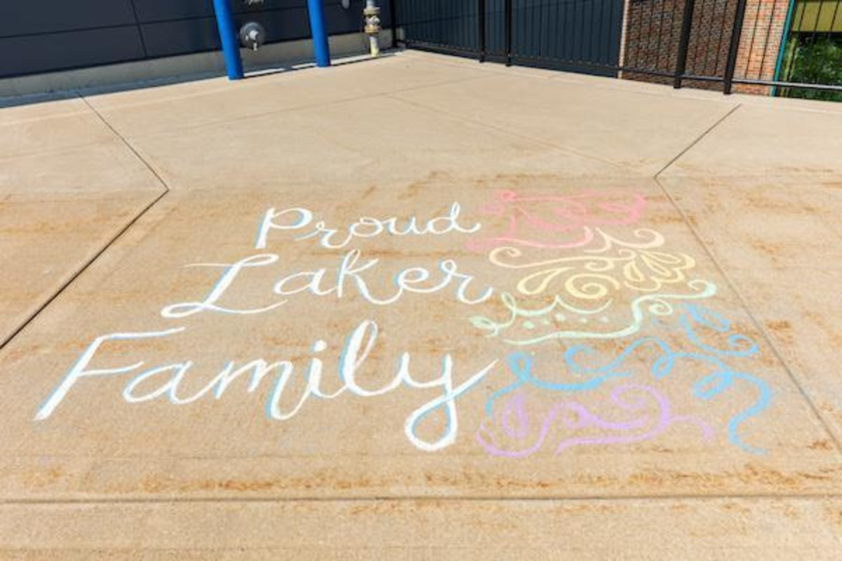 chalk drawings with proud laker family written beside them