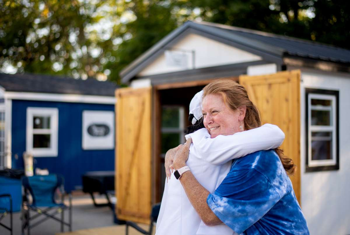 President Mantella hugging a student