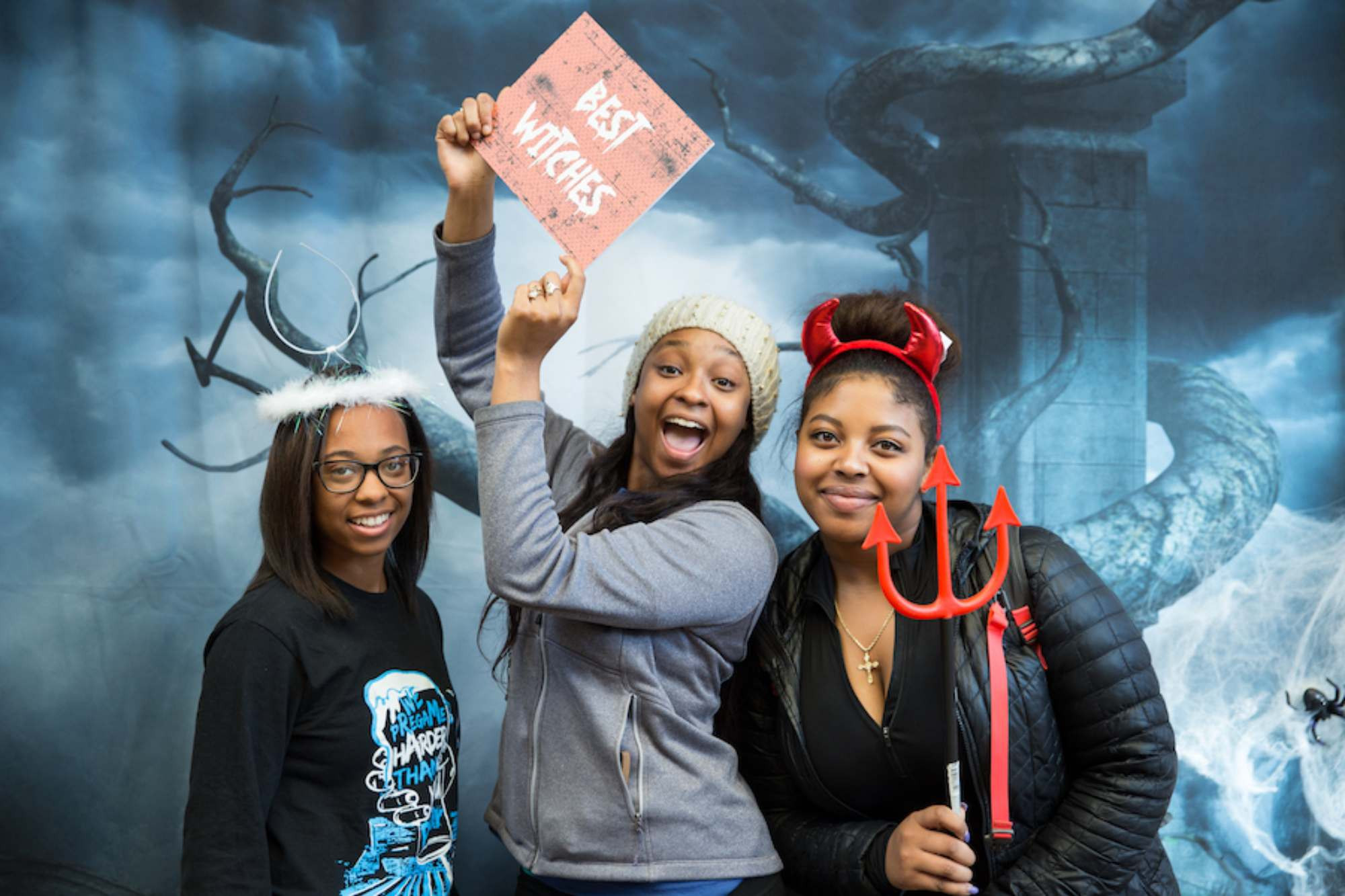 three girls posing at the Homecoming Photobooth