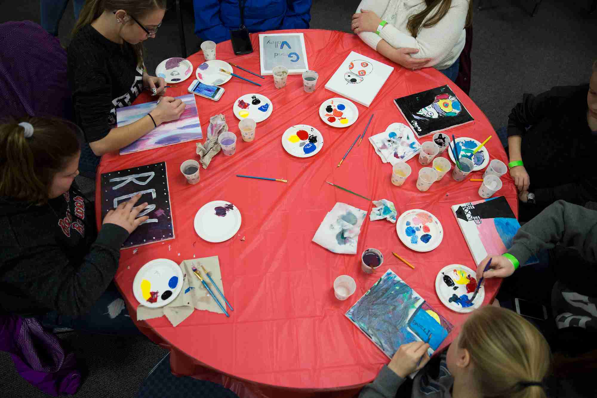 A table full of painting supplies