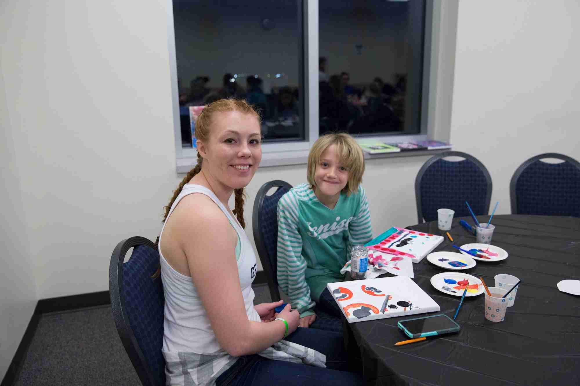 two siblings painting 