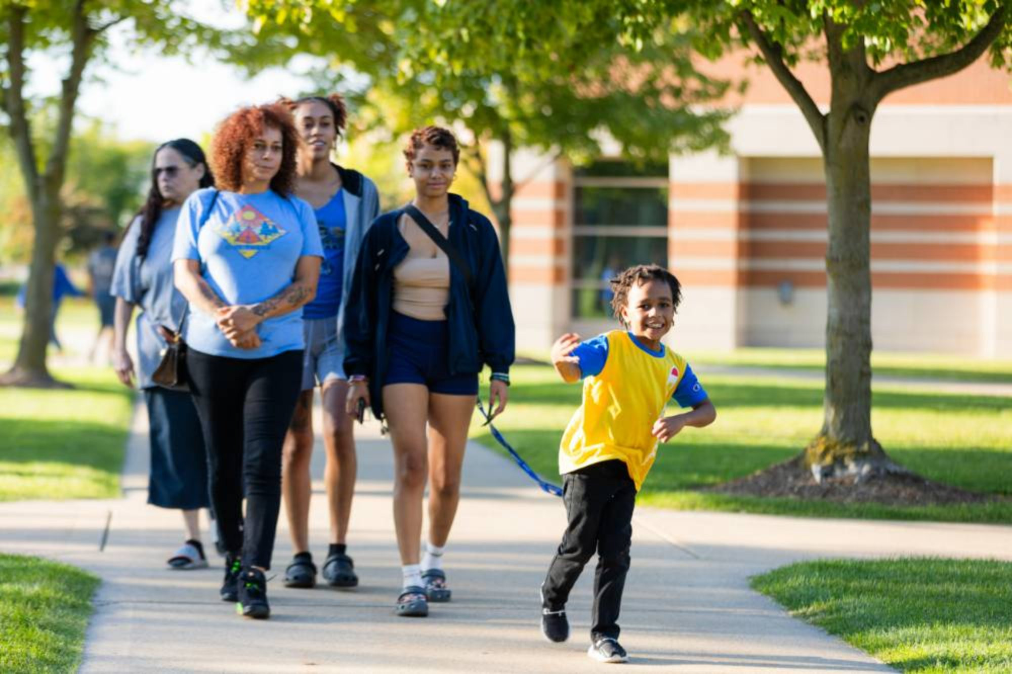 a family walking during the family weekend kickoff party