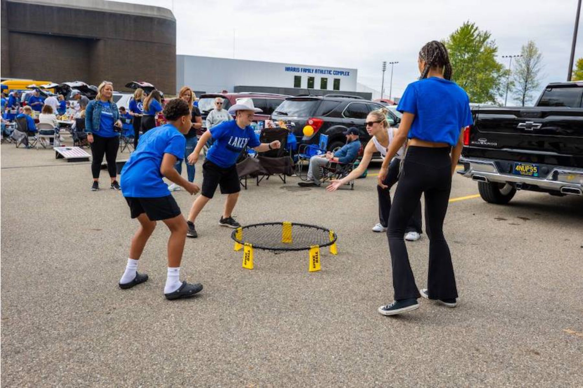 people playing a game of spikeball during family weekend