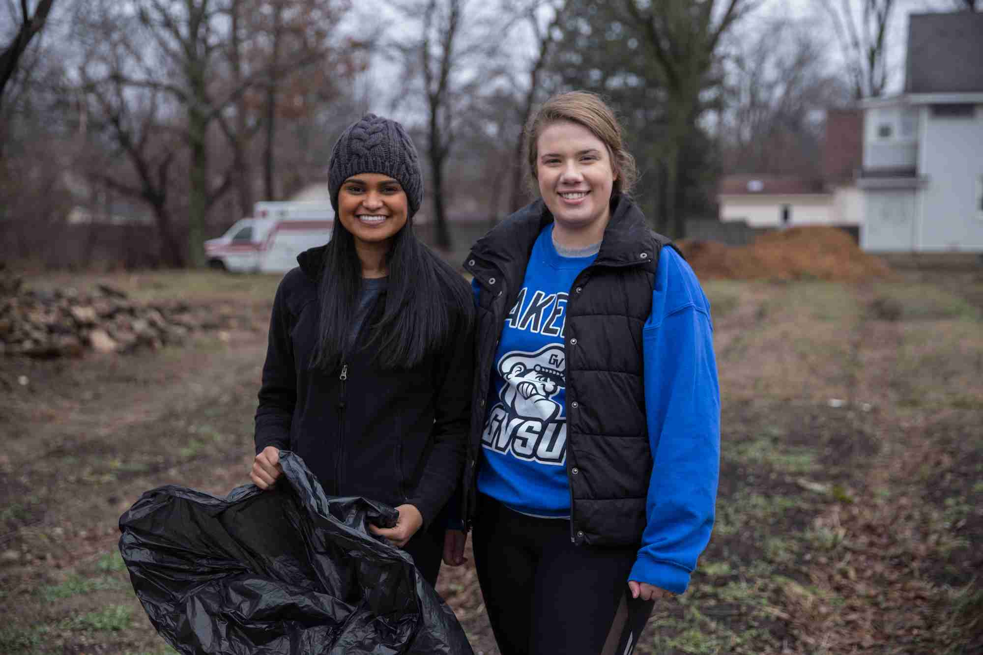 Students picking up trash outdoors