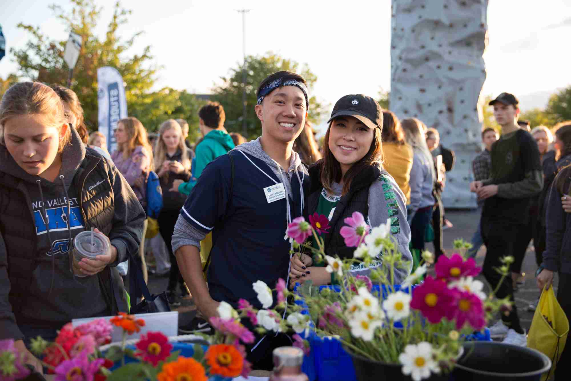 Students smiling together at campus life night 