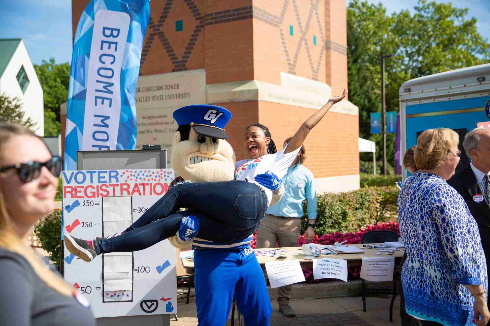 Louie the Laker picking up a student on national registration day 