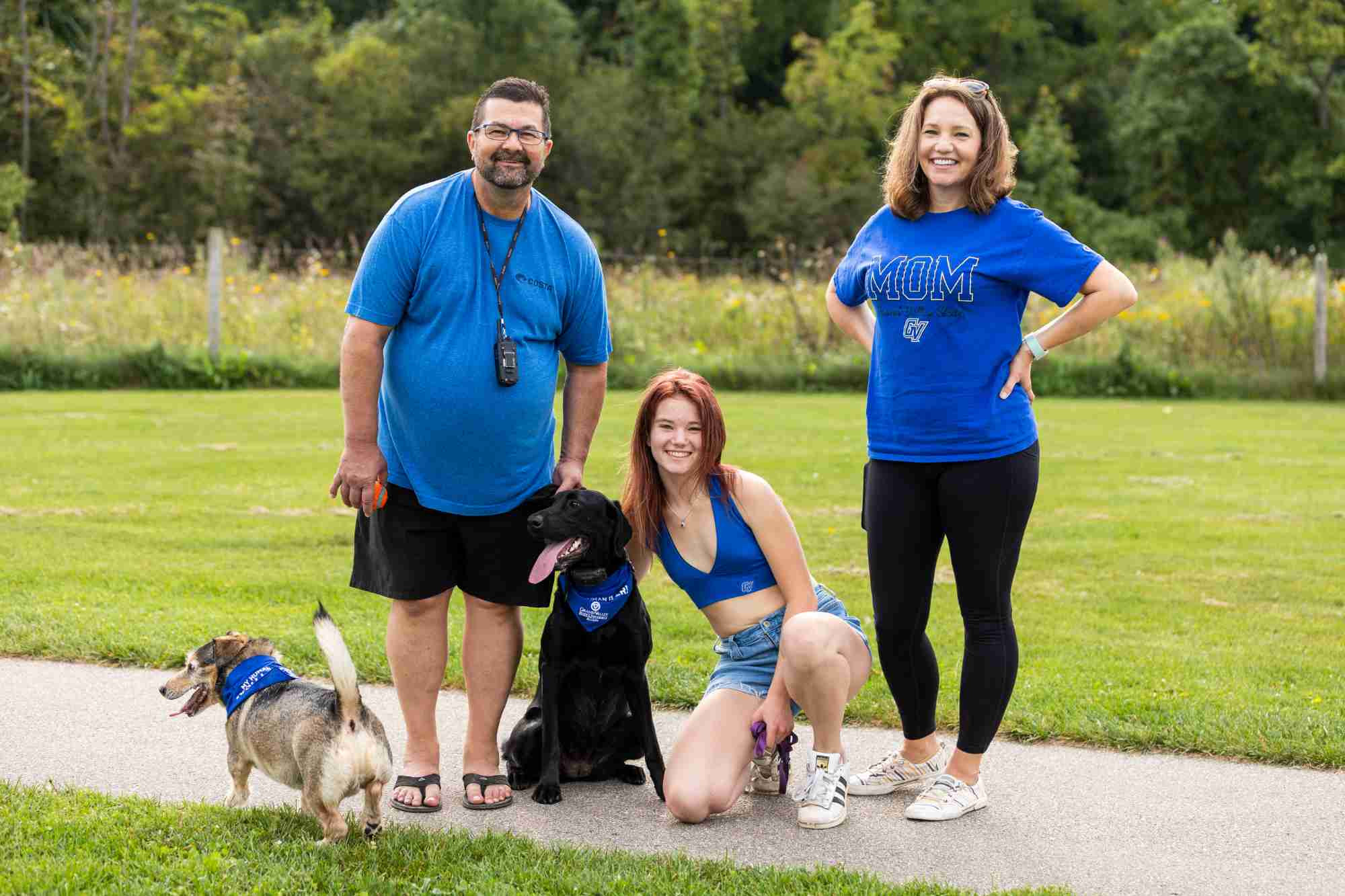 Family on a walk with their dogs in GV apparel 