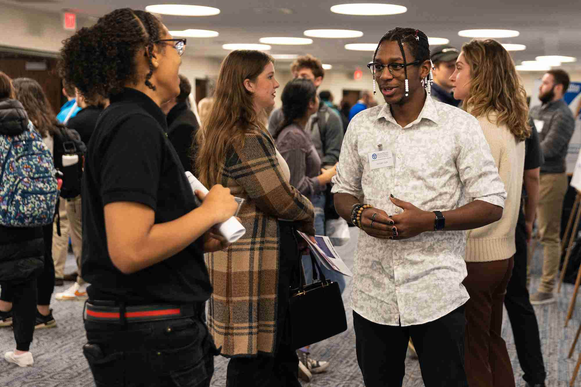 Student talking with a representative