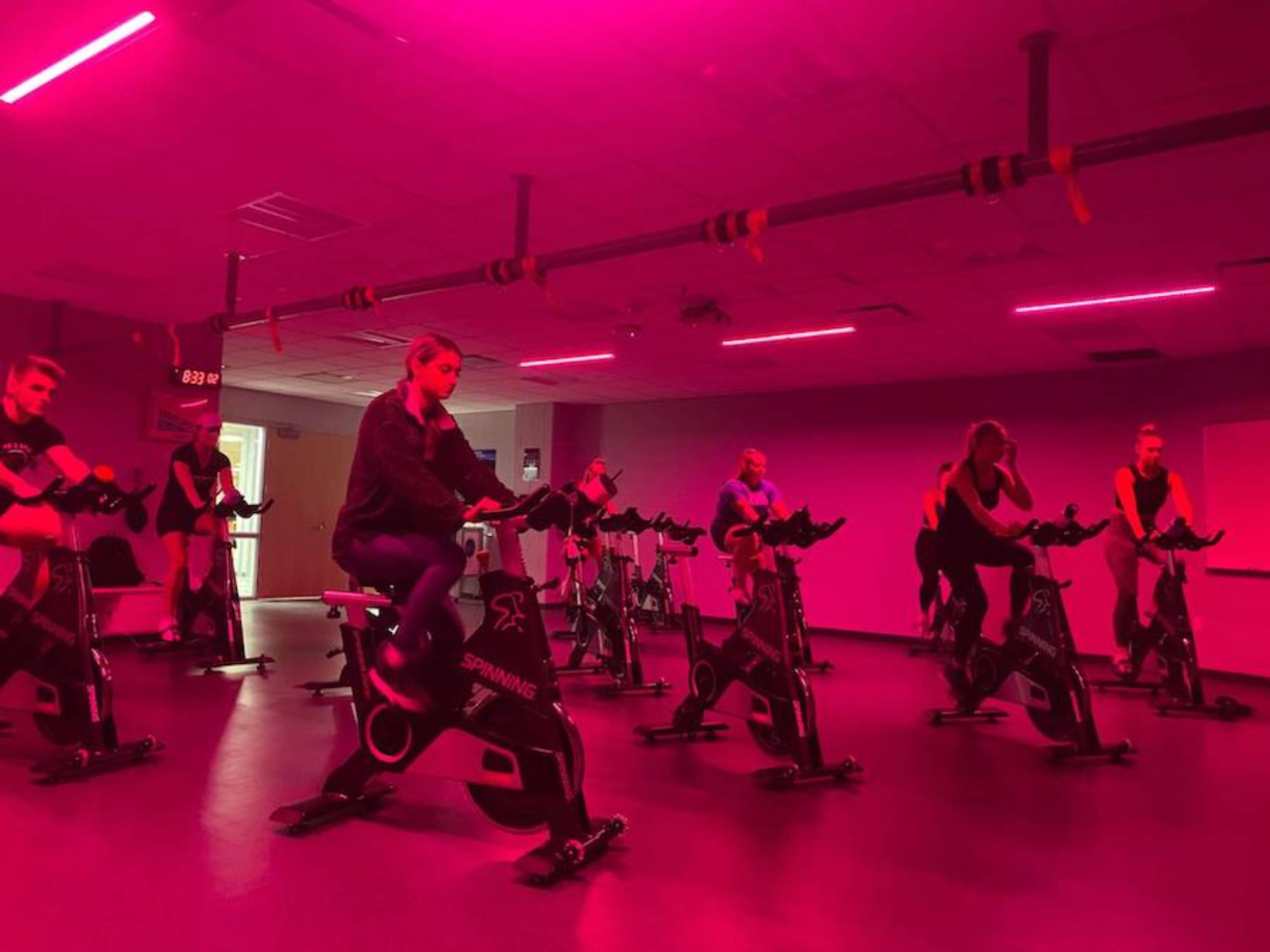 people on bikes doing a spin class