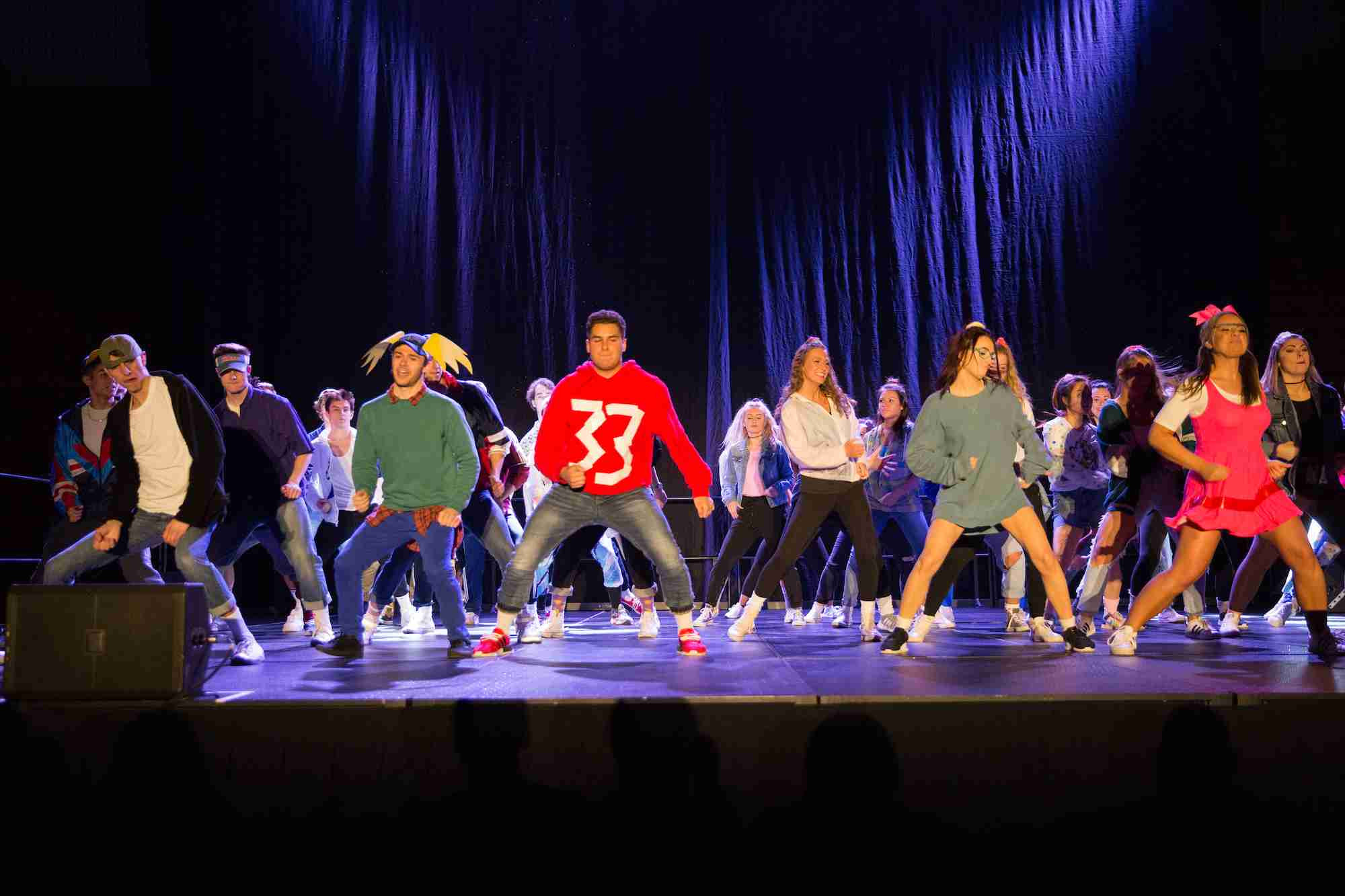 Greek life dancing on stage during the lip sync battle