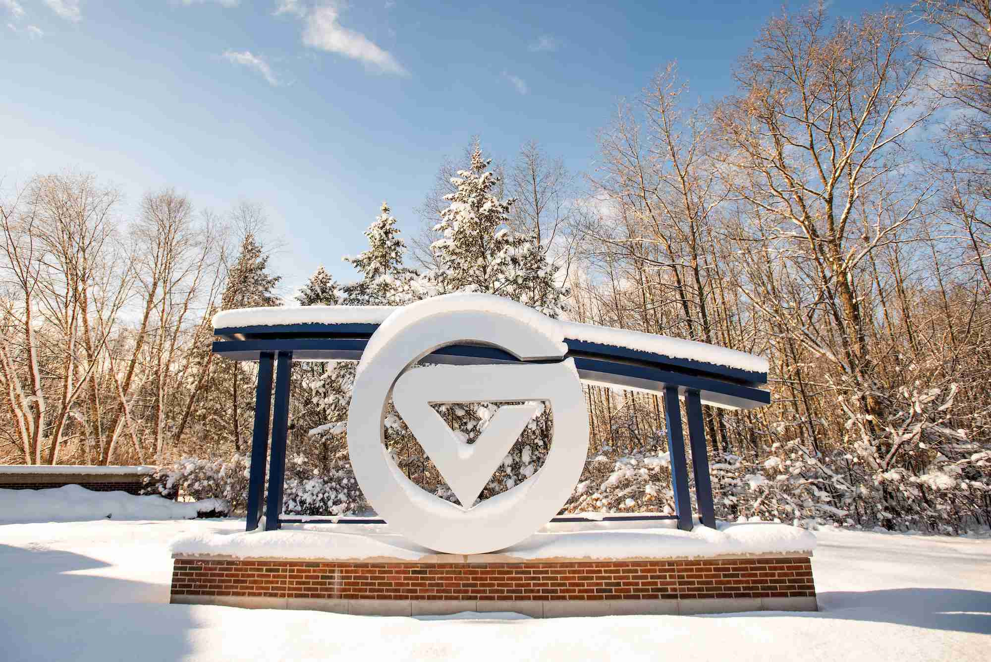 GVSU sign at the front entrance covered in snow