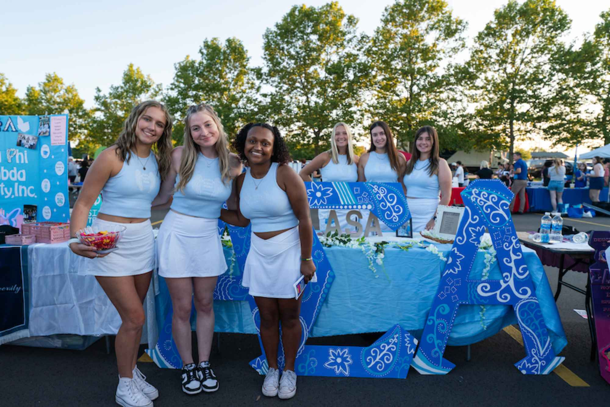 A sorority promoting their organization during Campus Life Night