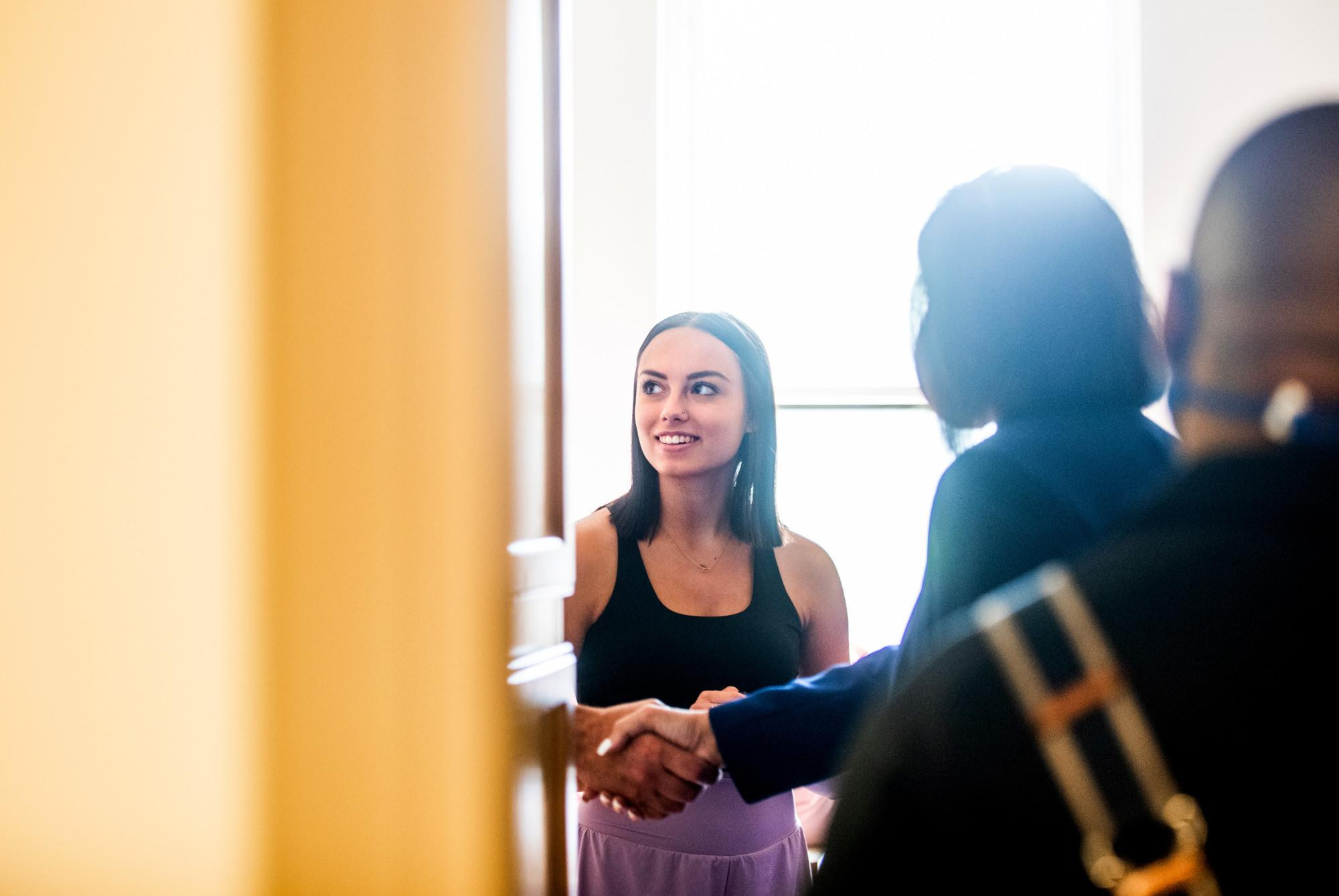 A student meeting president Mantella during move in 