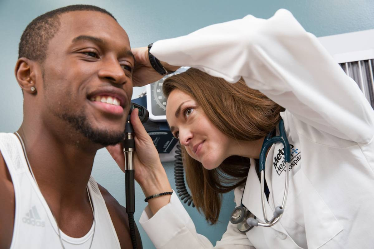 a student not feeling well getting checked out by a doctor