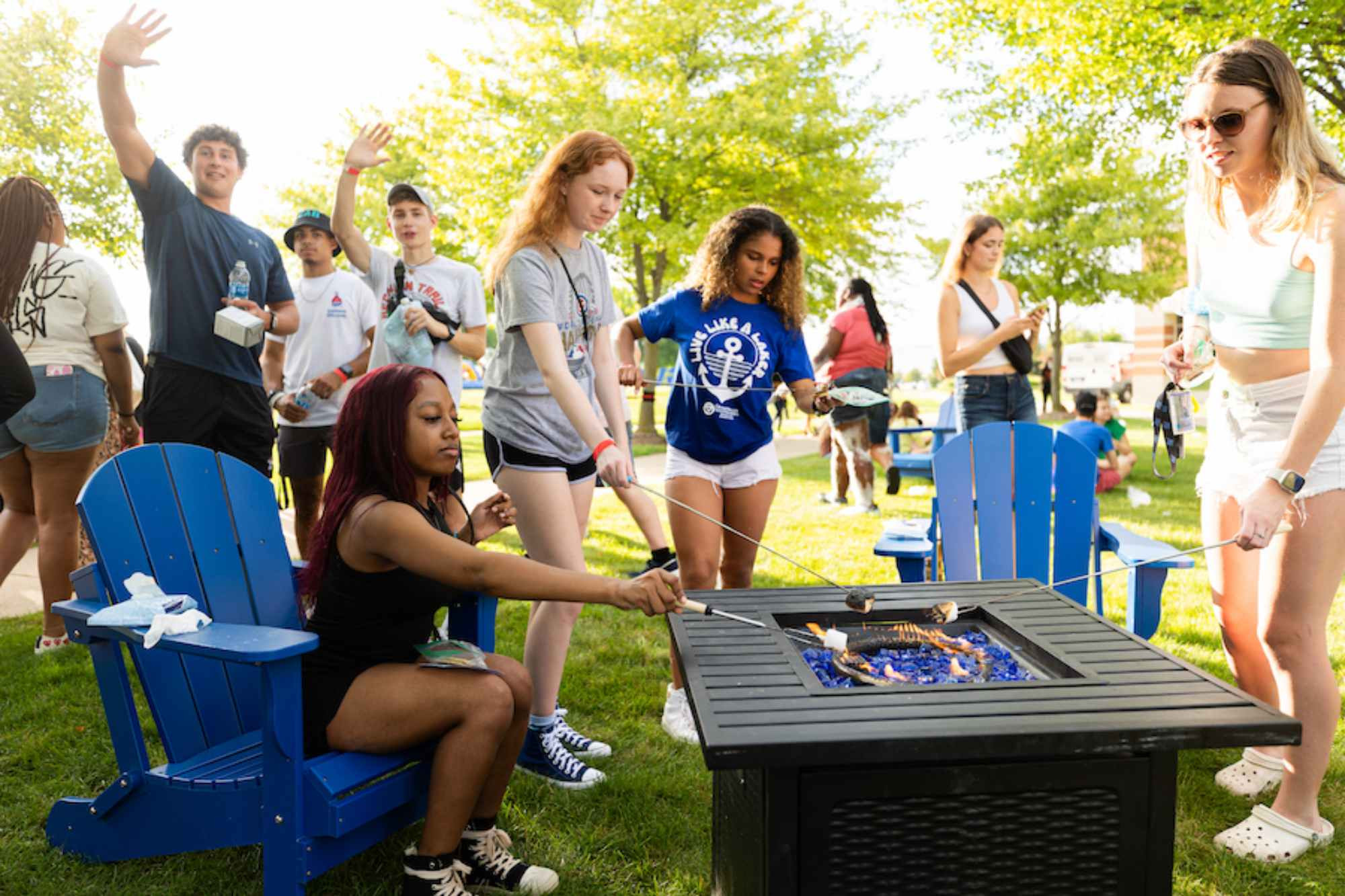 group of people making s'mores