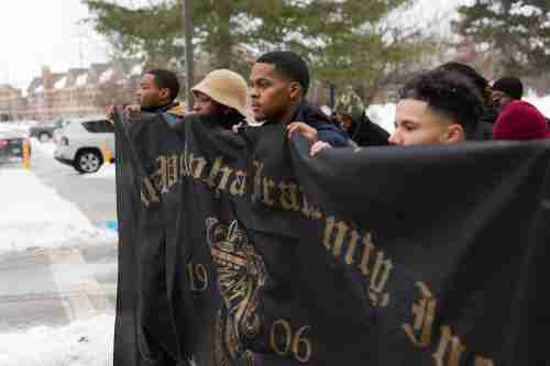Students holding up a banner during the mlk march