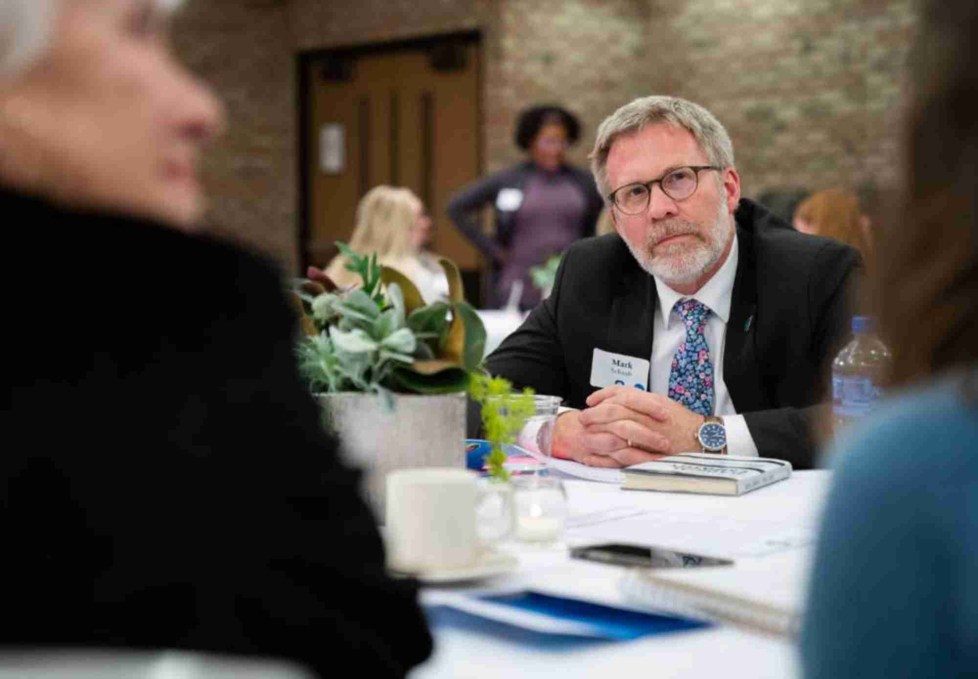 Man listening to someone speaking 