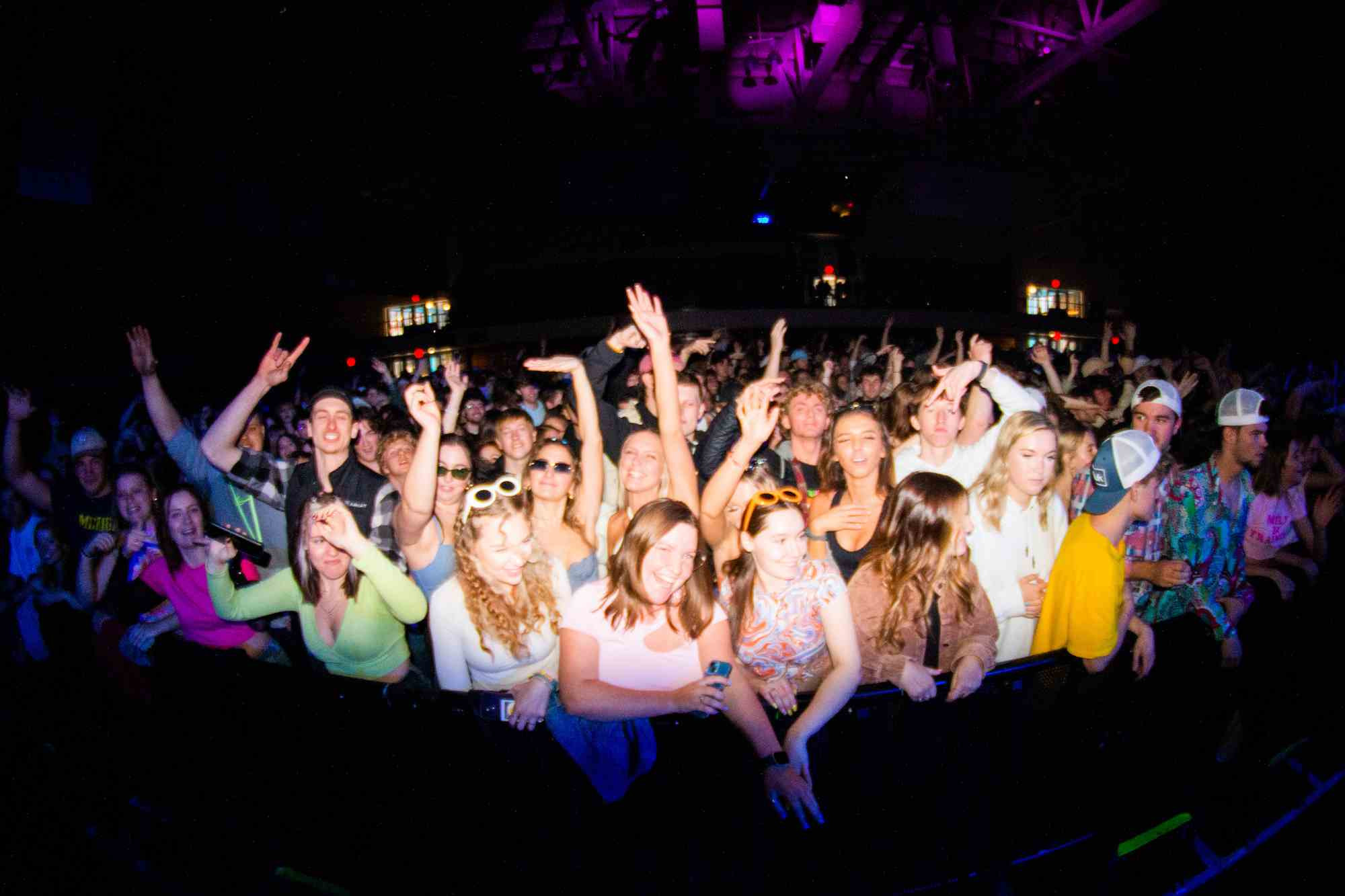 Crowd singing and dancing at the spring concert