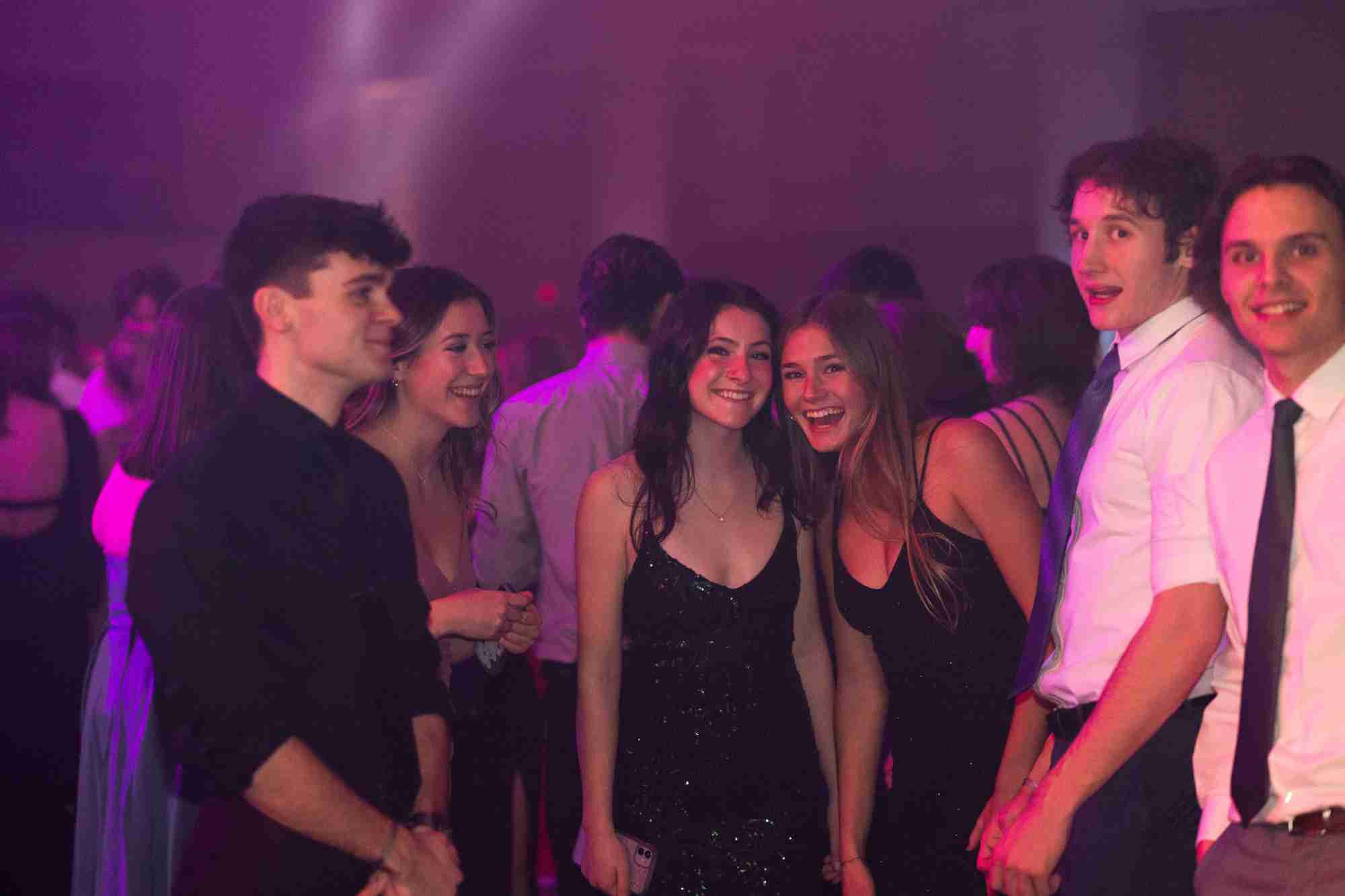 Students dressed formally smiling at the camera at Presidents' Ball